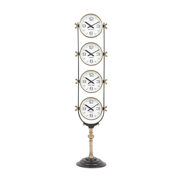 Libra Interiors Brushed Brass Four-Dial World City Floor Clock with vertically stacked New York, London, Hong Kong and Sydney dials on a pedestal base.