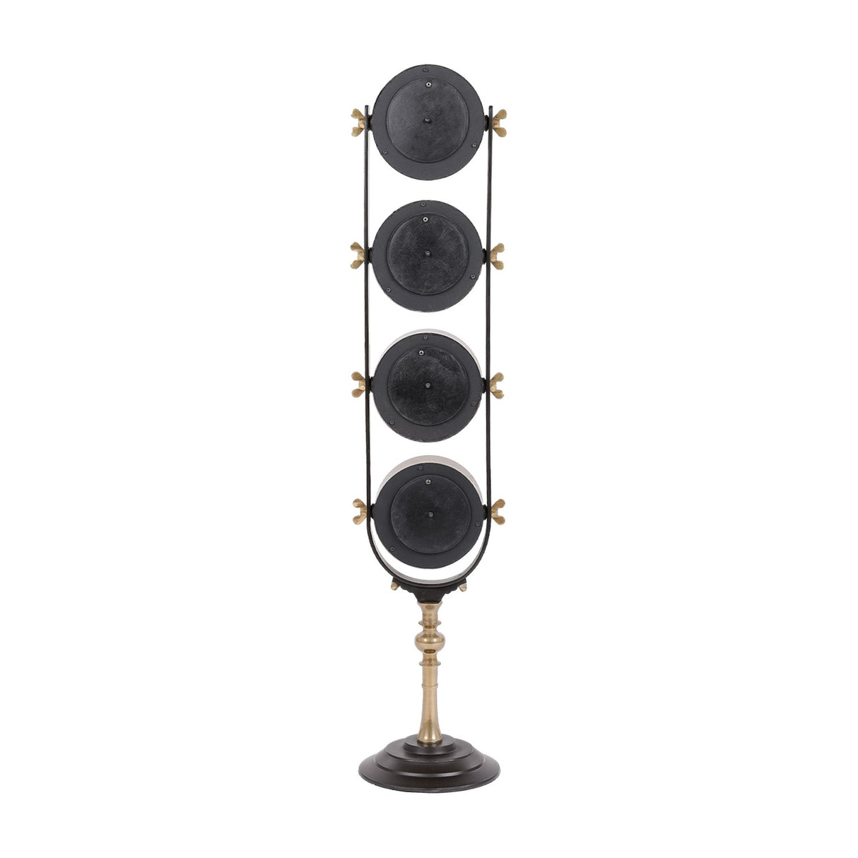 Libra Interiors Brushed Brass Four-Dial World City Floor Clock shown from the back with four circular black panels on a slim frame and pedestal base.