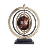 Libra Interiors Marble-Effect Brass Ring Armillary Globe with brown swirled resin orb, brass and black concentric rings, and stepped stone base.