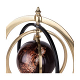 Close-up of the Libra Interiors Marble-Effect Brass Ring Armillary Globe, showing brass and black concentric rings around a glossy brown swirled orb.