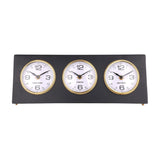 Libra Interiors Matt Black Three Dial Mantel Clock with Hong Kong, London and New York dials in gold bezels on a steel frame with small gold feet.
