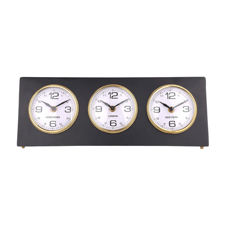 Libra Interiors Matt Black Three Dial Mantel Clock with Hong Kong, London and New York dials in gold bezels on a steel frame with small gold feet.