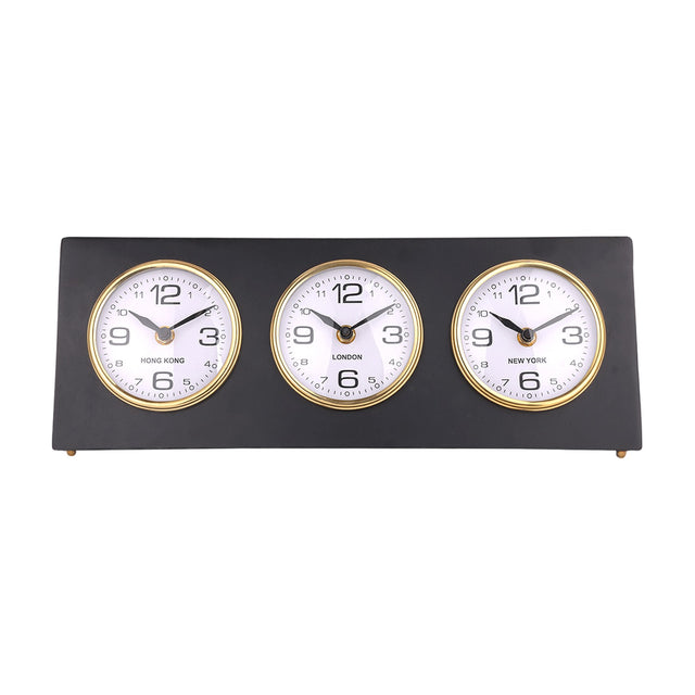 Libra Interiors Matt Black Three Dial Mantel Clock with Hong Kong, London and New York dials in gold bezels on a steel frame with small gold feet.