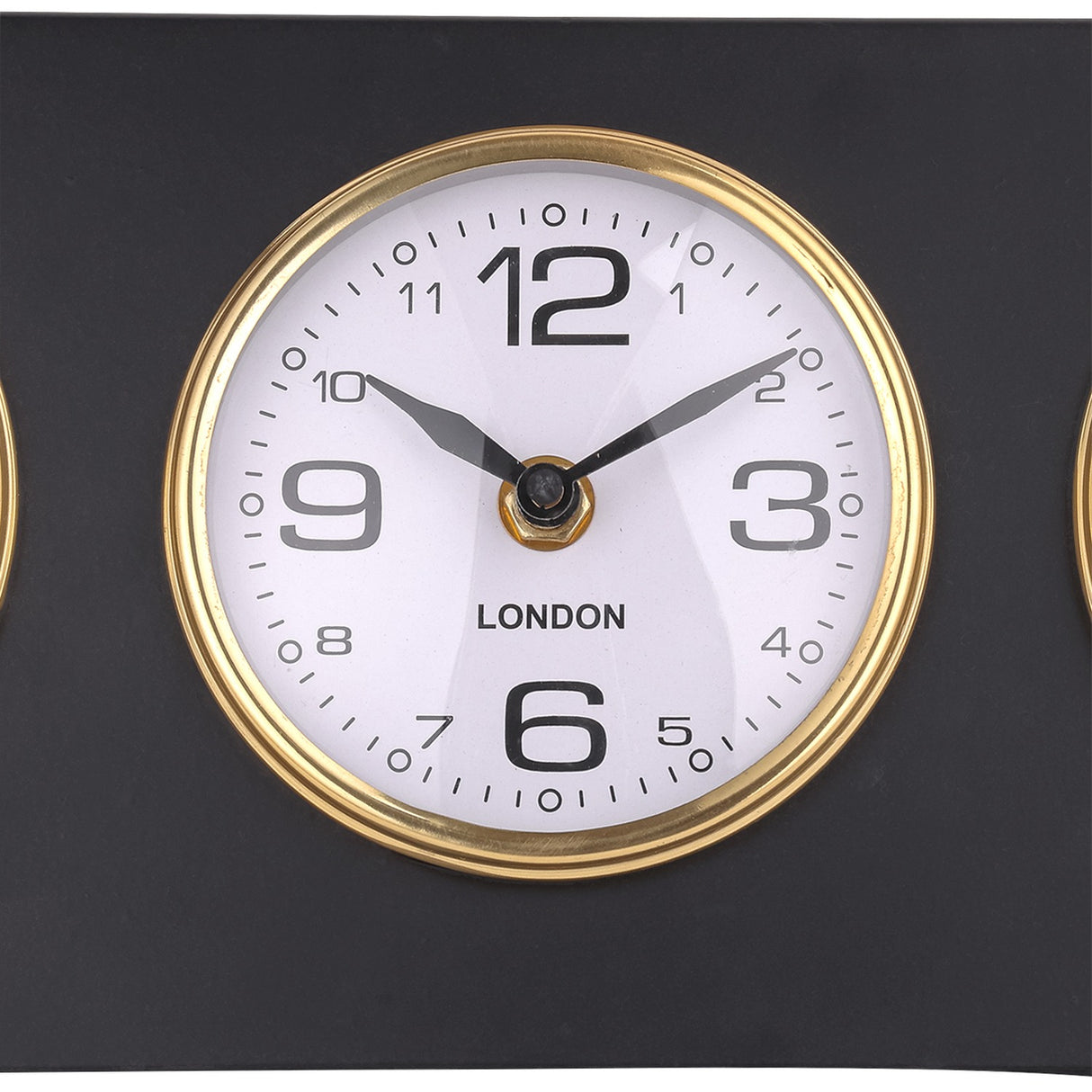 Close-up of the London dial on the Libra Interiors Matt Black Three Dial Mantel Clock, showing a white face with black numerals inside a gold bezel.