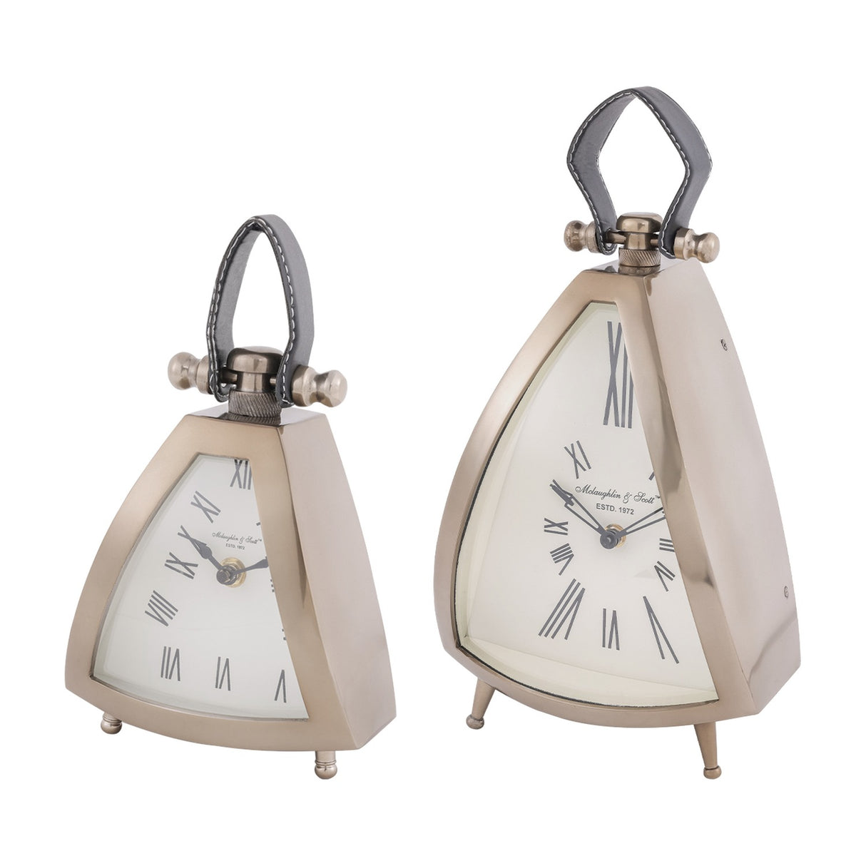 Libra Interiors Brushed Brass Curved Front Mantel Clocks in two sizes, triangular aluminium cases with cream Roman numeral dials and black leather handles.