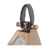 Close-up of the Libra Interiors Brushed Brass Curved Front Mantel Clock's top, showing the stitched black leather handle and brass pivot fittings.