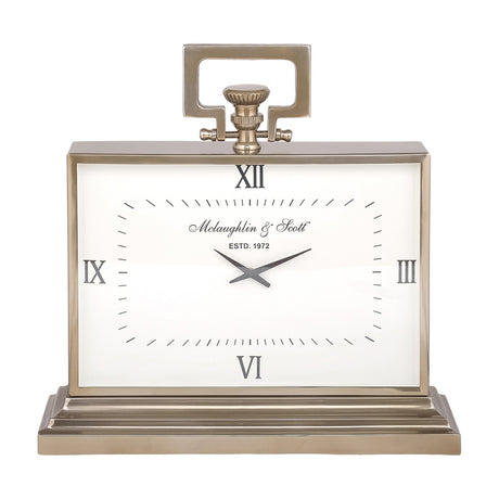 Libra Interiors brushed brass rectangular mantel clock with white Roman numeral dial, looped handle, fluted knob and stepped plinth base on a white background.
