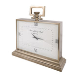 Libra Interiors brushed brass rectangular mantel clock with white Roman numeral dial, looped handle, fluted knob and stepped plinth, on a white background.