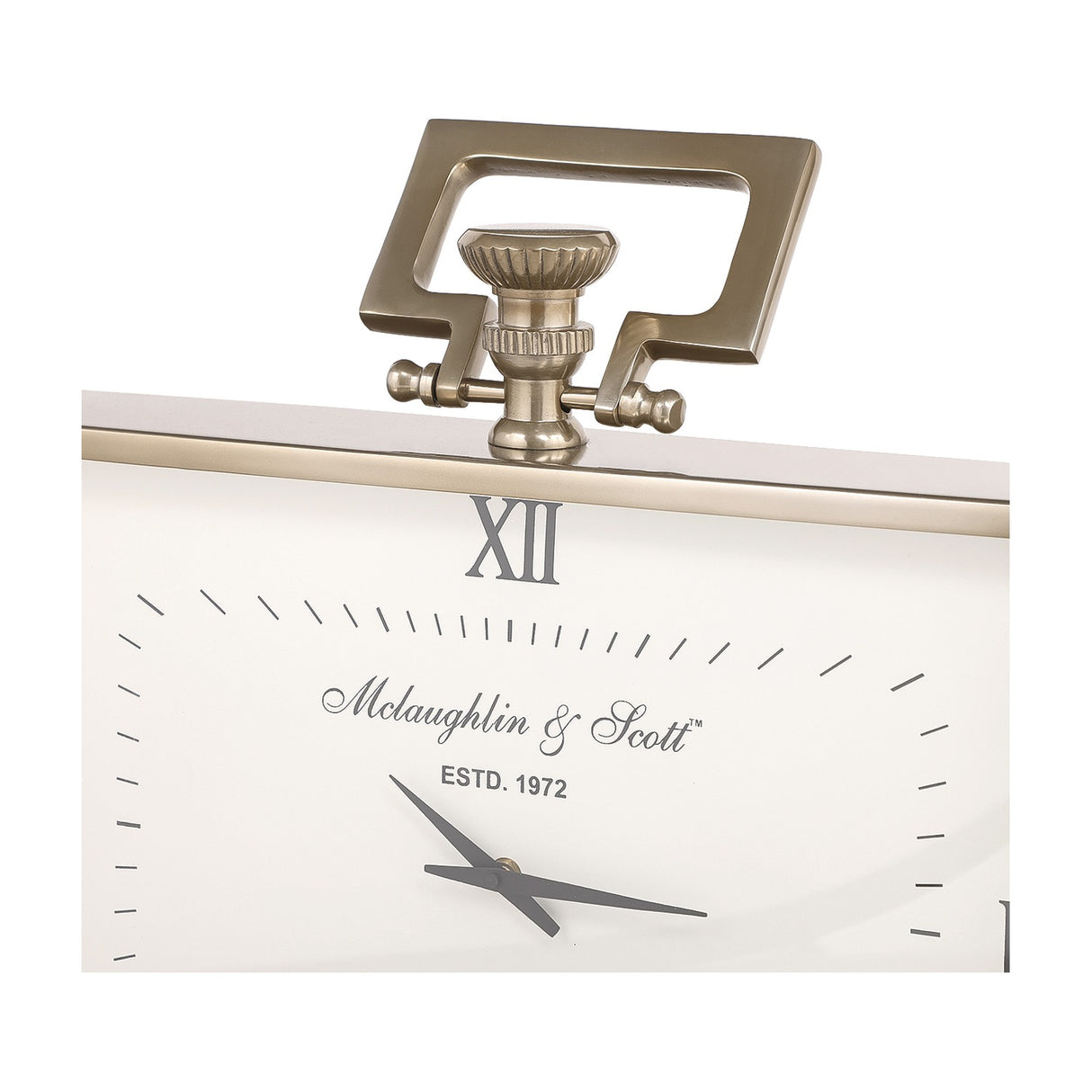 Close-up of Libra Interiors Brushed Brass Rectangular Mantel Clock showing the squared loop handle, fluted knob, Roman numeral XII and slim grey hands.