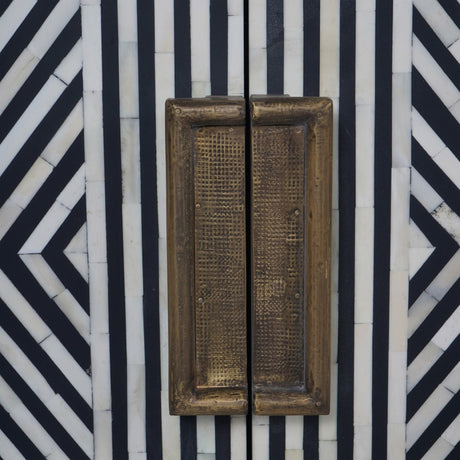 Close-up of Libra Interiors Bone Inlay Sideboard showing black and white geometric inlay pattern and antique brass-finish handles on the central doors.