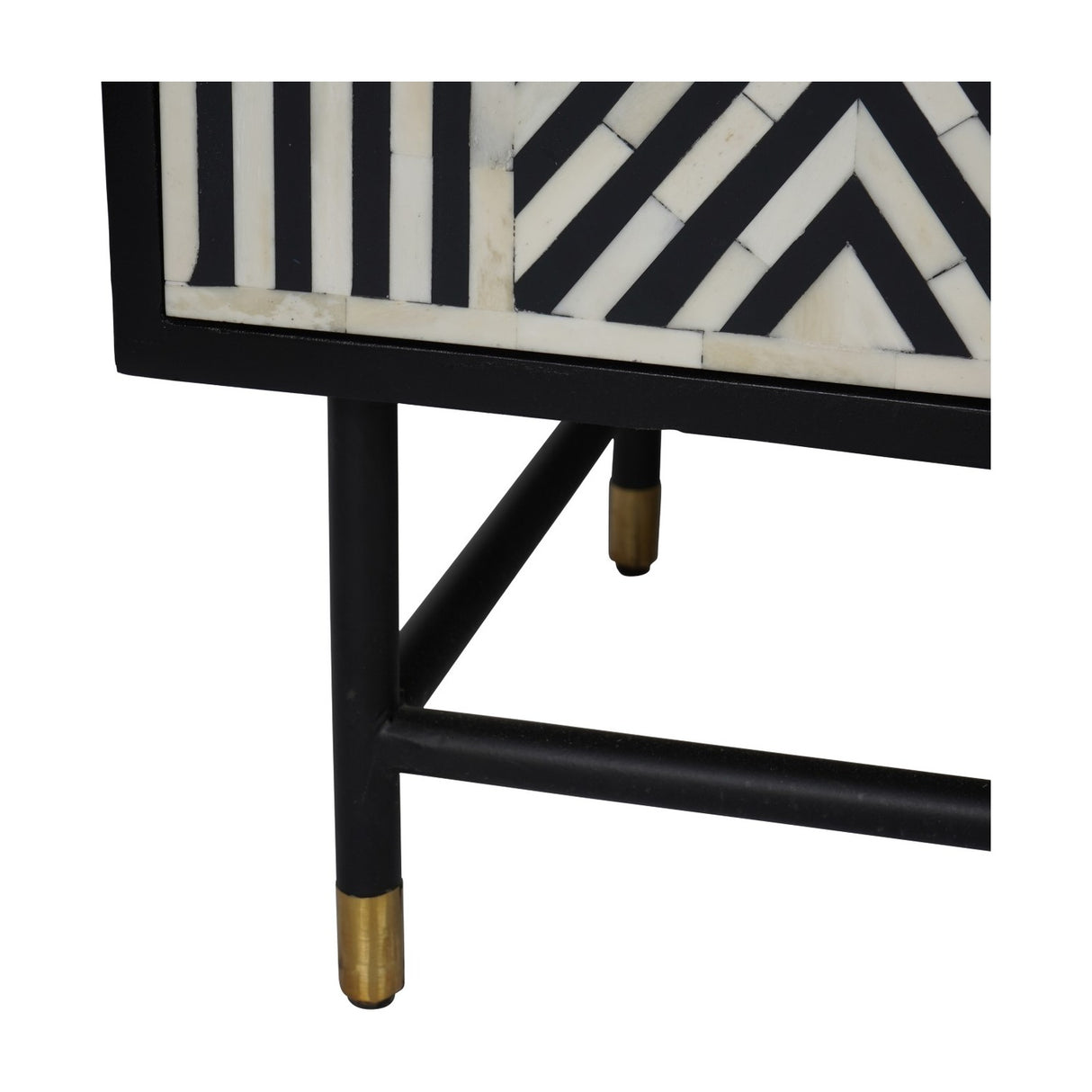 Close-up of Libra Interiors Bone Inlay Four Door Sideboard in monochrome, showing black frame corner, geometric bone inlay pattern and brass-capped legs.