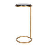 Libra Interiors Round Marble Aged Gold Side Table in black, with a round marble top and cantilevered aged gold iron frame on a looped base.