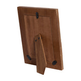 Rear view of Libra Interiors Geometric Wood and Resin Photo Frame in brown, showing the fold-out portrait strut and black metal fittings on a white background.