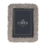 Libra Interiors Antiqued Leaf aluminium 5x7 photo frame in silver, with a raised botanical leaf border and wooden inner frame, shown in portrait orientation.