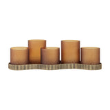 Libra Interiors Hammered Glass 5 Light Amber Lantern with five frosted amber votives at varying heights on a ribbed aged gold iron base.