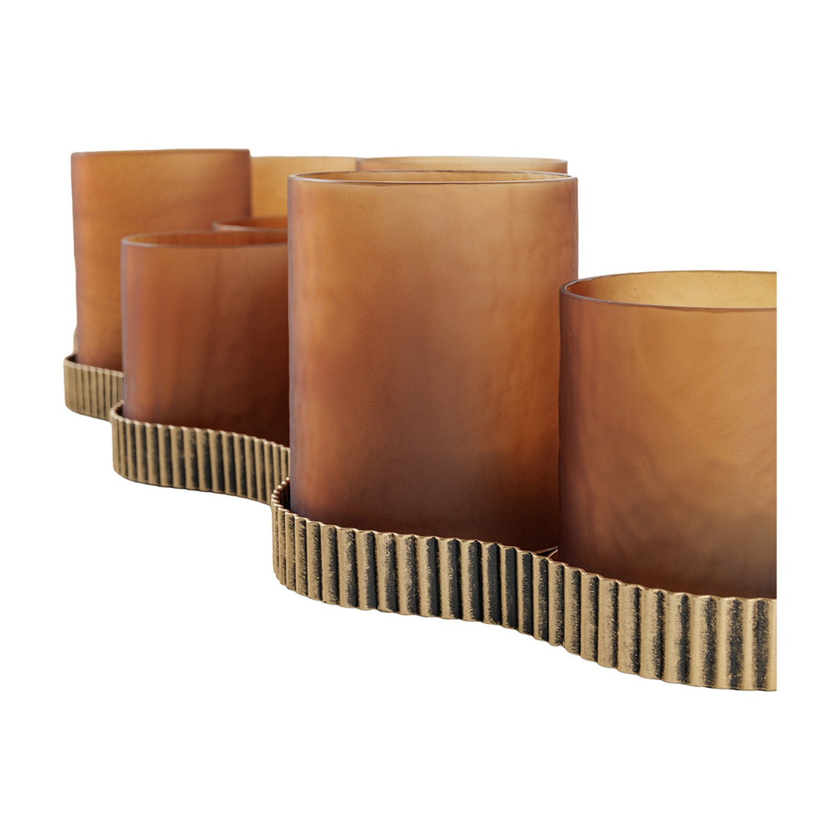 Libra Interiors Hammered Glass 9-Light Amber Lantern shown close-up with matt amber votive cups on a corrugated aged gold base against a white background.