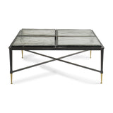 Libra Interiors Textured Glass Square Coffee Table in black, with four brick-patterned glass slabs on an iron frame with crossbar and brass-toned tapered feet.