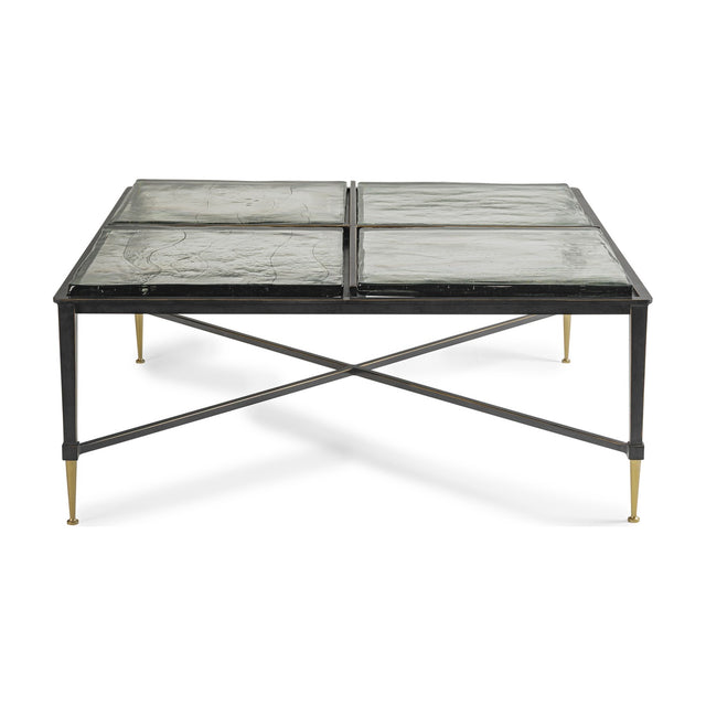 Libra Interiors Textured Glass Square Coffee Table in black, with four brick-patterned glass slabs on an iron frame with crossbar and brass-toned tapered feet.