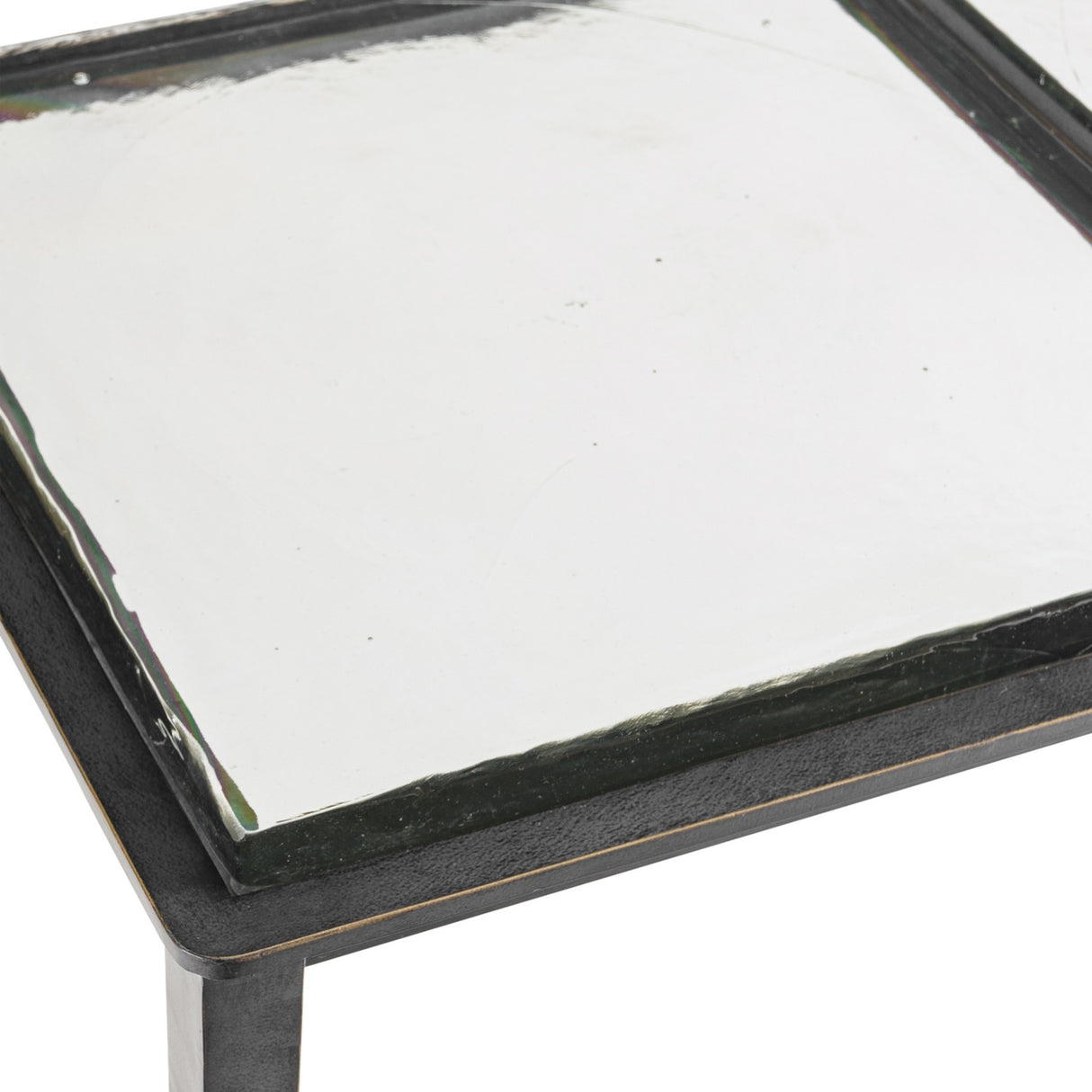 Close-up of the Libra Interiors Textured Glass and Iron Console Table showing the brick-pattern glass top set within a black iron frame.