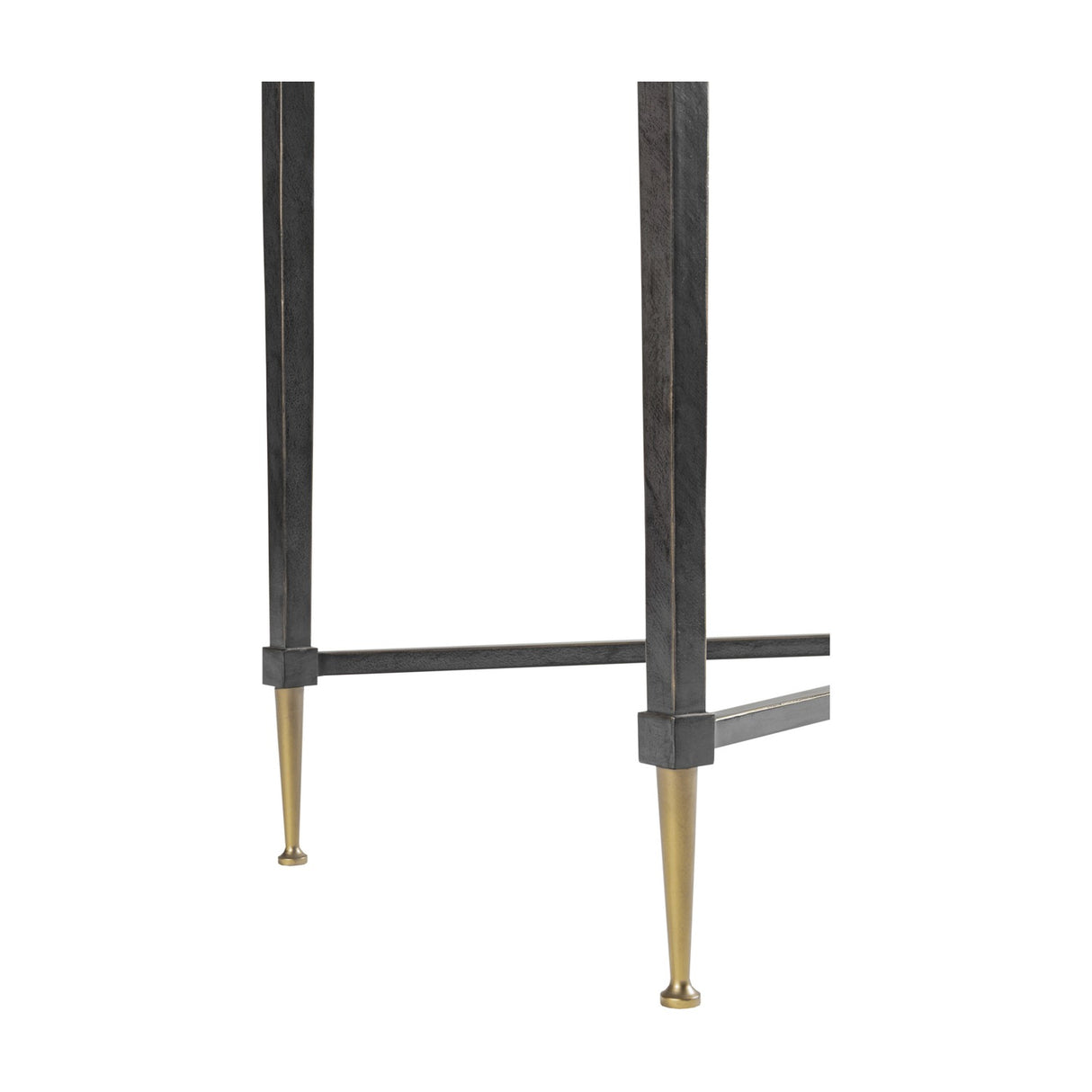 Close-up of Libra Interiors Textured Glass and Iron Console Table base, showing tapered black iron legs with brushed brass feet and low crossbar.