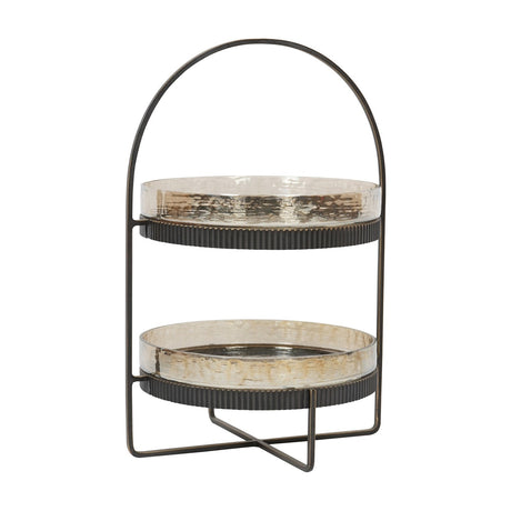 Libra Interiors Hammered Glass Two Tier Cake Stand with bronze iron frame, ribbed rims, arched carry handle and crossed base on a white background.