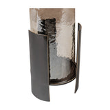 Libra Interiors Ribbed Glass Bronzed Iron Hurricane Lantern in brown, shown from a low angle highlighting the curved iron uprights cradling the textured shade.