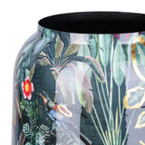 Close-up of Libra Interiors Enamel Iron Tropical Vase in multicolour, showing glossy foliage, hummingbird and floral print with gold accents on a green ground.