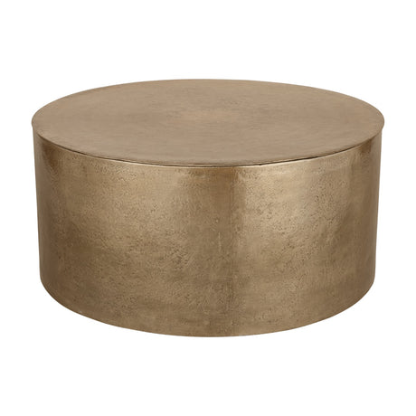 Libra Interiors Drum Storage Coffee Table in champagne gold aluminium with a round drum shape and pitted, textured finish, on a plain white background.
