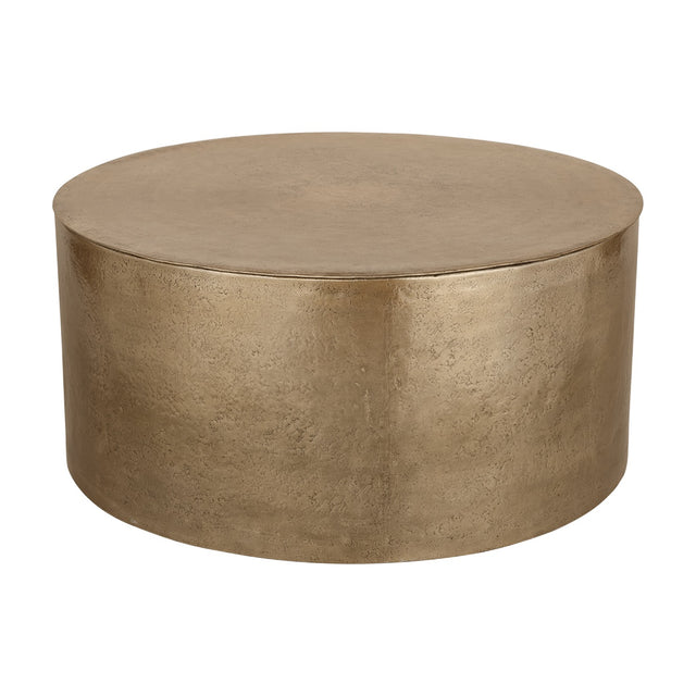 Libra Interiors Drum Storage Coffee Table in champagne gold aluminium with a round drum shape and pitted, textured finish, on a plain white background.