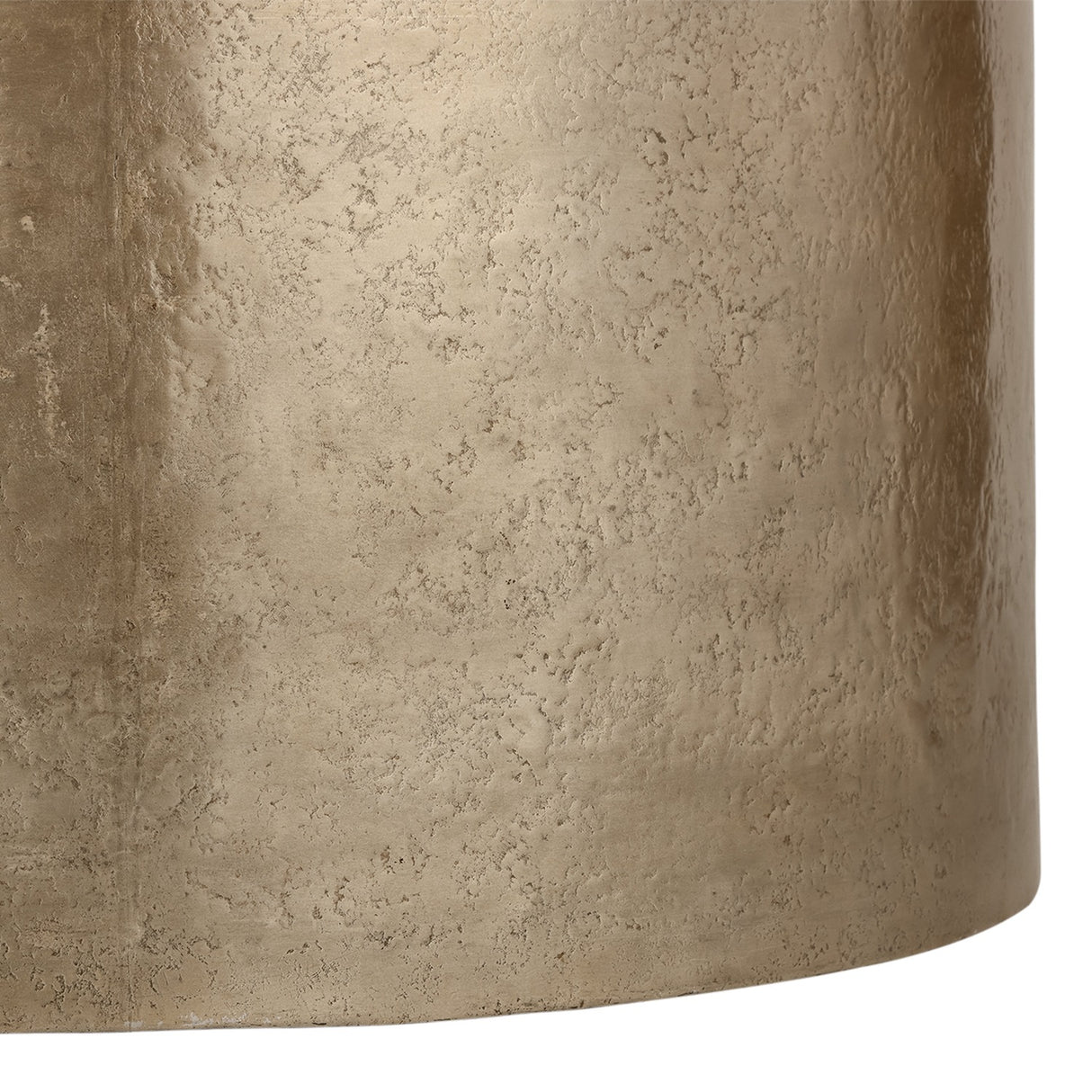 Close-up of the Libra Interiors Drum Storage Coffee Table showing its pitted champagne gold aluminium surface with soft sheen and textured patina finish.
