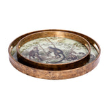 Libra Interiors Round Glass Monkey Jungle serving tray set of two in antiqued gold with cream botanical print and inset handles, nested on white.
