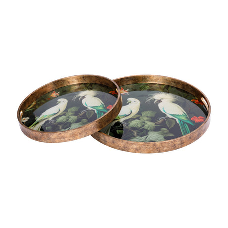 Libra Interiors Round Glass Tropical Bird Serving Tray set of two in gold, printed with white cockatoos and foliage, framed by antiqued gold-effect rims.