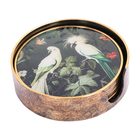 Libra Interiors Tropical Bird round acrylic coaster set in an antique gold-rimmed holder, printed with white cockatoos among green foliage and red blooms.