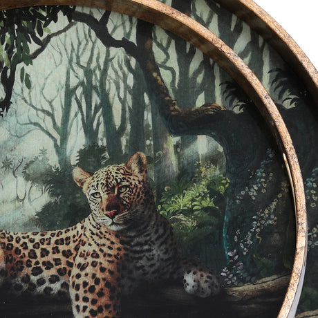 Close-up of Libra Interiors Leopard glass round serving tray with jungle leopard artwork beneath glass, framed by an antiqued gold-effect rim.