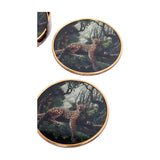 Libra Interiors Jungle Print round acrylic coasters with leopard illustration and antiqued gold-effect rims, shown alongside their matching holder.