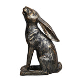 Libra Interiors Antique Bronze Stargazing Hare Sculpture in textured resin, seated on a plinth with head tilted skyward, shown against a white background.