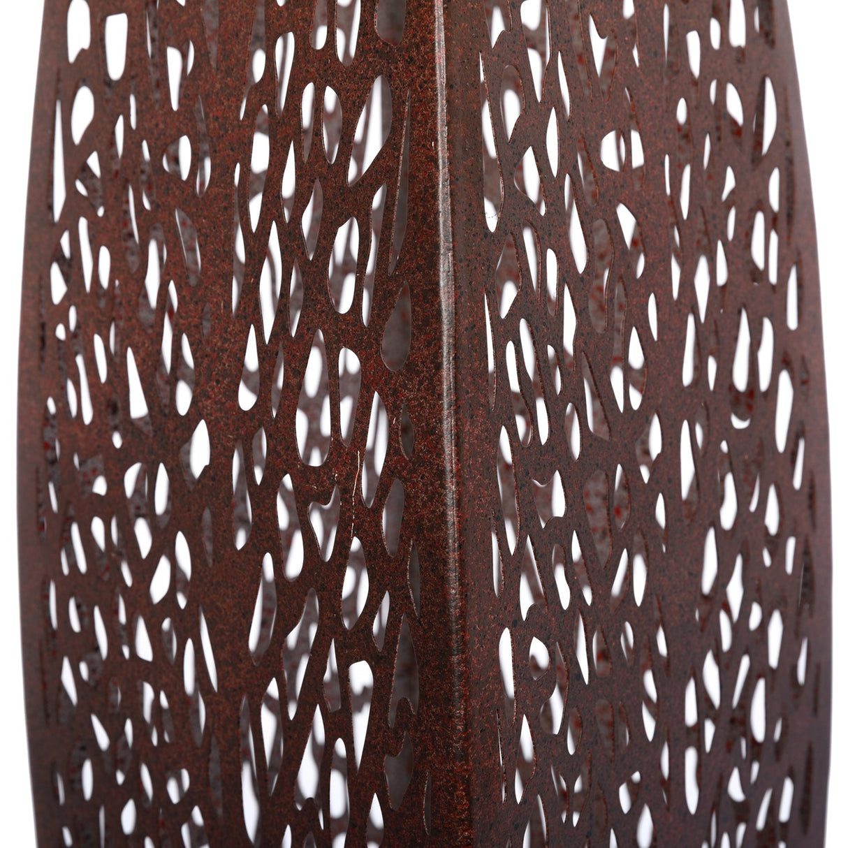 Close-up of Libra Interiors Solar Cut-Out Iron Leaf Sculpture showing the pierced organic cut-out pattern across the warm bronze rust iron surface.