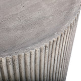 Close-up of Libra Interiors Fluted Round Coffee Table in grey, showing the textured stone effect top edge meeting the vertical ribbed cylindrical side.