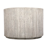 Libra Interiors Fluted Round Coffee Table in grey, a cylindrical composite drum with vertical ribbed fluting and a weathered stone effect finish.