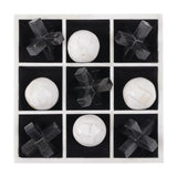 Libra Interiors Bone and Horn Inlay Noughts and Crosses Game shown from above with four white bone balls and five black horn crosses in a nine-square tray.