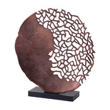 Libra Interiors Coral Cut-Out round aluminium sculpture in bronze, with solid disc half and branching coral latticework, on a black rectangular base.