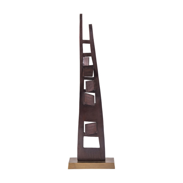 Libra Interiors tall aluminium sculpture in blackened bronze with tapered asymmetric uprights, geometric cut-outs and angular blocks on a brass-toned base.