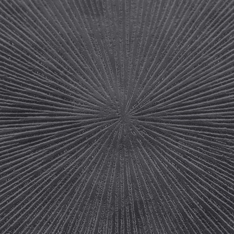 Close-up of the Libra Interiors Grooved Sunburst Round Side Table showing the cast aluminium top with radial black grooves fanning from the centre.