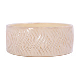 Libra Interiors Embossed Glazed Ceramic Bowl Candle in ivory, a wide shallow ceramic vessel with a flowing geometric relief pattern under a glossy glaze.