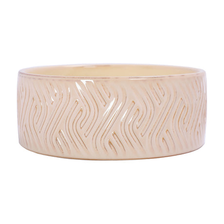 Libra Interiors Embossed Glazed Ceramic Bowl Candle in ivory, a wide shallow ceramic vessel with a flowing geometric relief pattern under a glossy glaze.