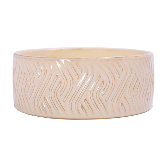 Libra Interiors Embossed Glazed Ceramic Bowl Candle in ivory, a wide shallow ceramic vessel with a flowing geometric relief pattern under a glossy glaze.