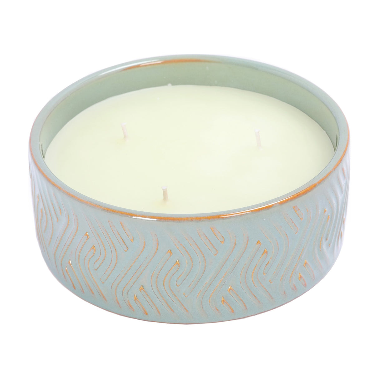 Libra Interiors embossed ceramic triple-wick candle in soft blue-green with gold geometric relief pattern and unscented ivory wax, on a white background.