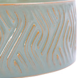 Close-up of the Libra Interiors Embossed Ceramic Bowl Triple-Wick Candle in green, showing the glossy blue-green glaze and amber embossed wave pattern.