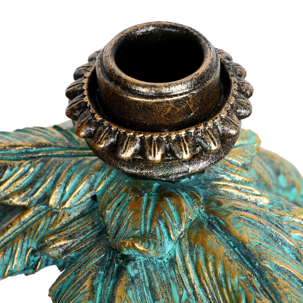 Close-up of the Libra Interiors Giraffe & Palm resin candle holder showing the antique gold taper cup nestled among textured verdigris palm fronds.