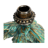 Close-up of the Libra Interiors Palm Tree and Leopard Candle Holder showing the gold taper socket above textured verdigris green and gold palm fronds.